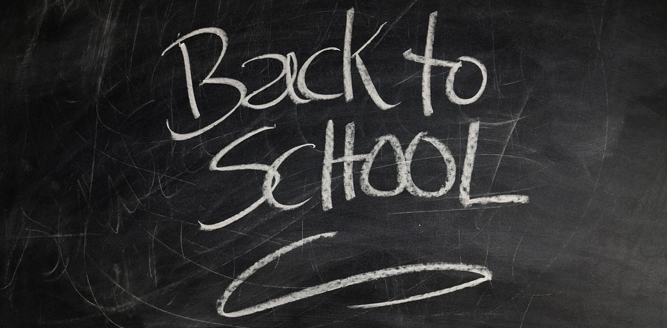 black board with Back to School written on it in white chalk
